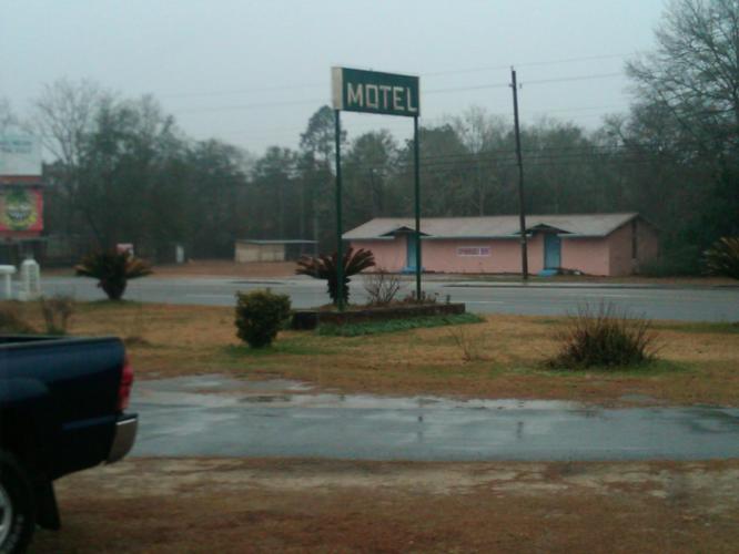 This place couldn't even afford to put its name on the sign... Just Motel. The rain only adds to the experience. Haha.